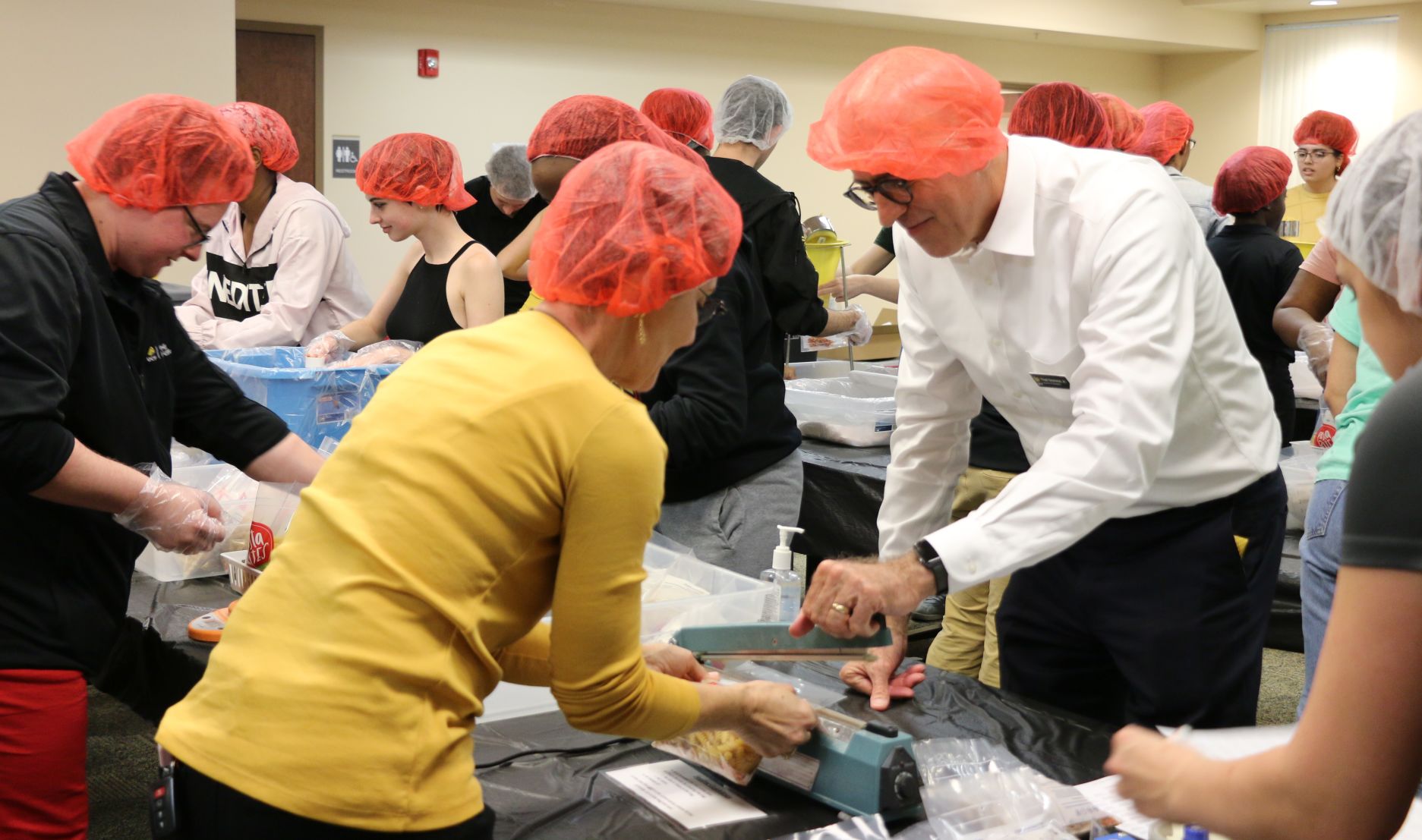 Student volunteers packed thousands of meals for the Knights Pantry